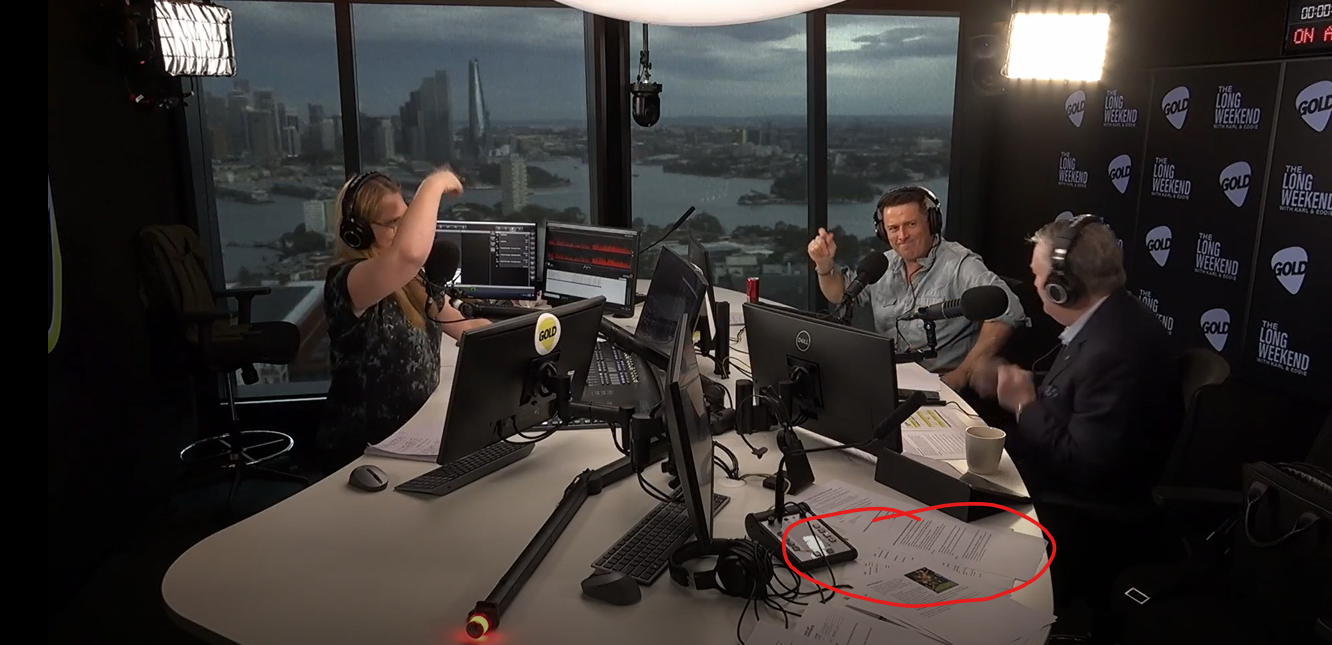 Confidential papers visible on studio desk during recording